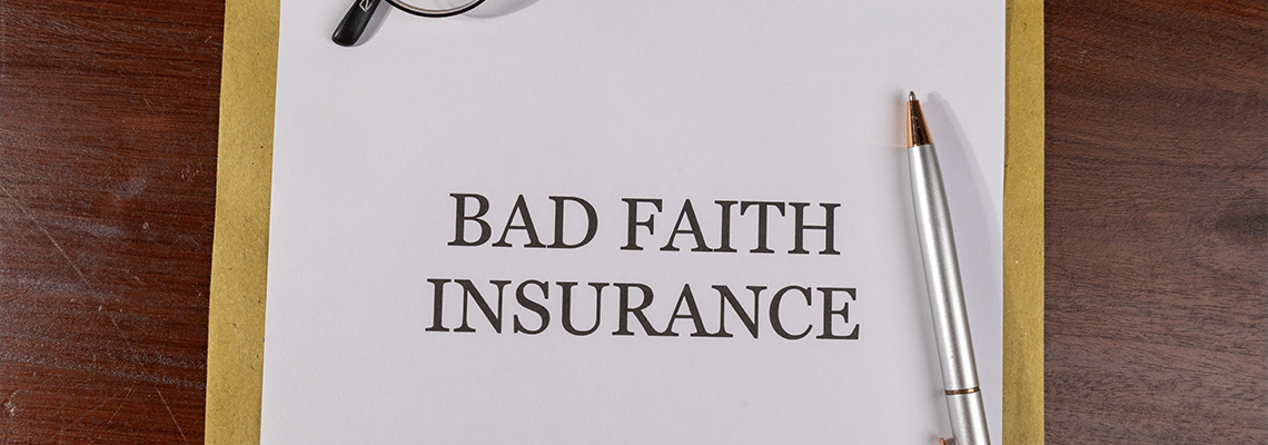 Legal Paper Titled ‘Bad Faith Insurance’ Placed on Envelope with Pen