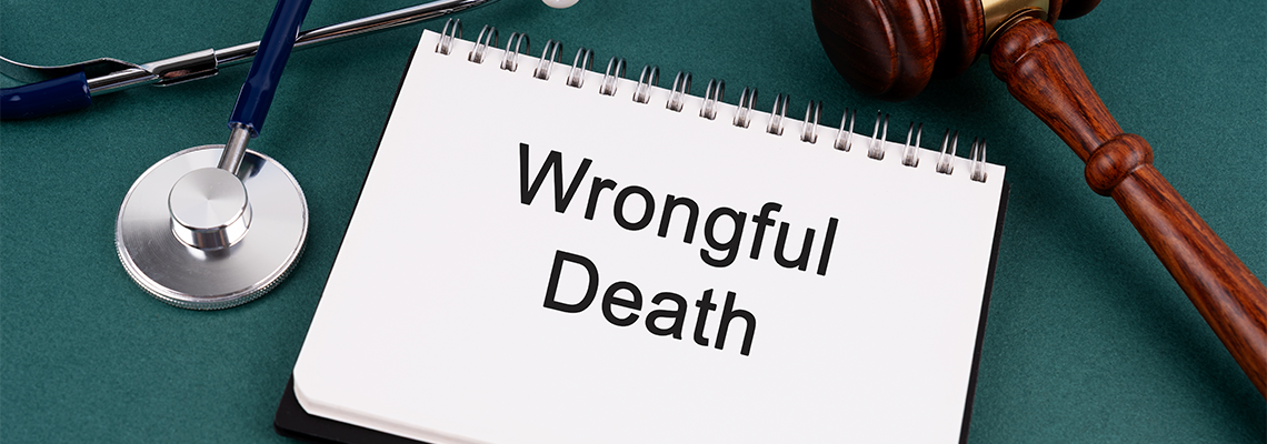 High angle view of Gavel and Wrongful Death text on a Notebook