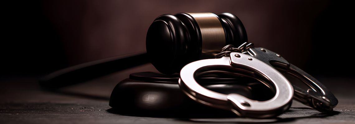 Gavel and Handcuff in table