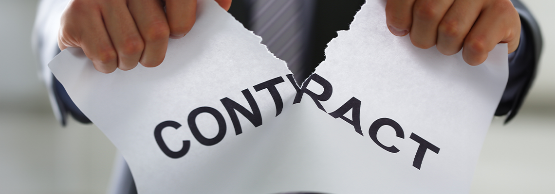 White collar worker in suit and tie tear contract closeup