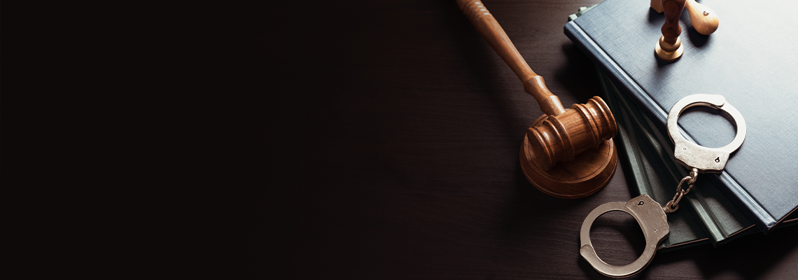 Crime and violence concept with handcuffs and gavel