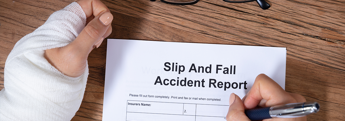 Woman Hand Filling The Slip And Fall Injury Report