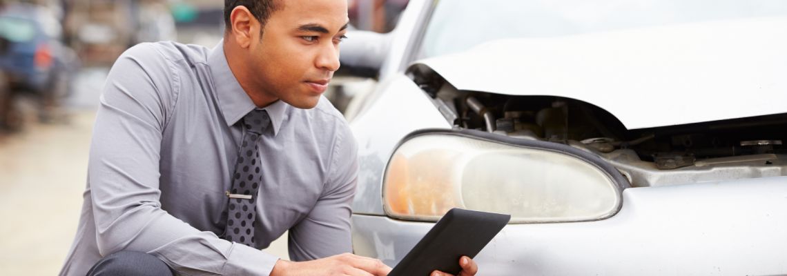 Insurance adjuster inspecting damages