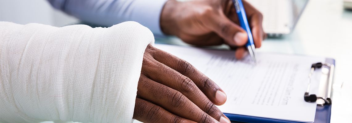 Injured person filling worker compensation form