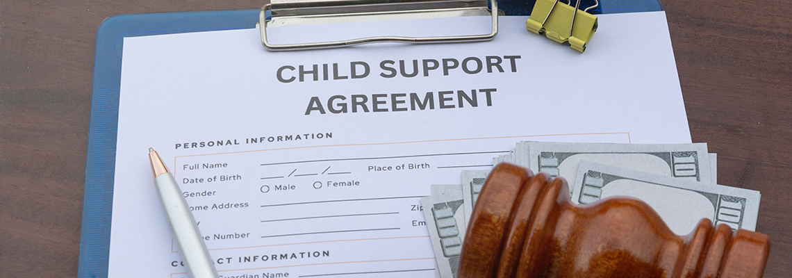 Child Support Payment, Gavel and Legal Agreement Paper on Desk