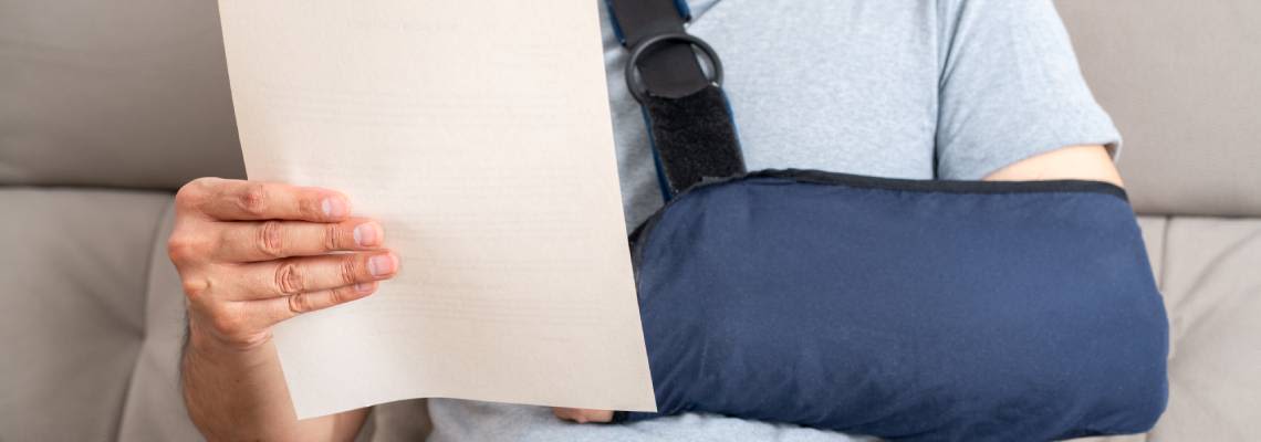 Women with injured hand reading SSDI benefit letter