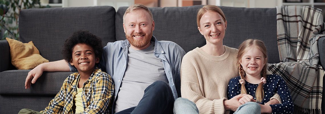Happy family with adopted child