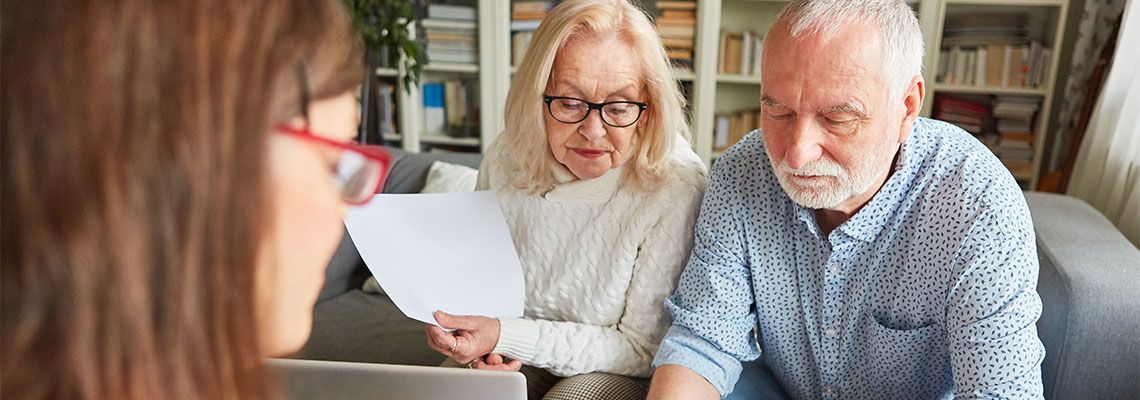 Old man signing power of attorney document