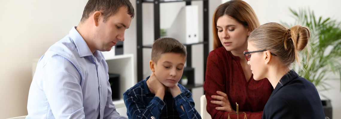 Divorced parents with child consulting with attorney