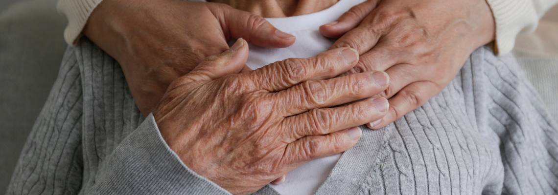 Young person expressing care towards elderly women