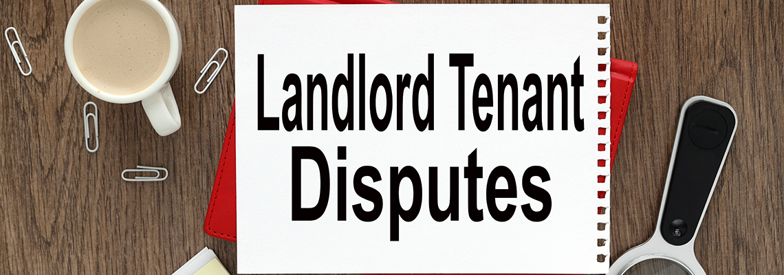 Landlord Tenant Disputes open notepad with text on a rustic background