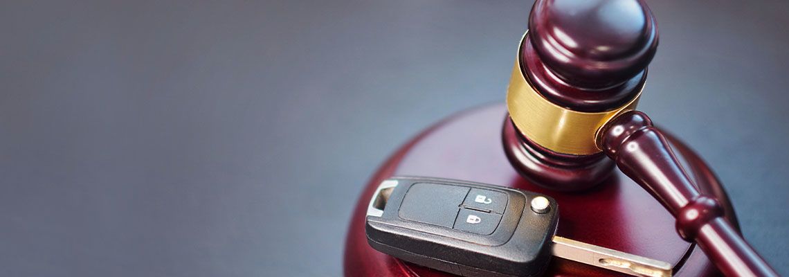 Car key next to gavel