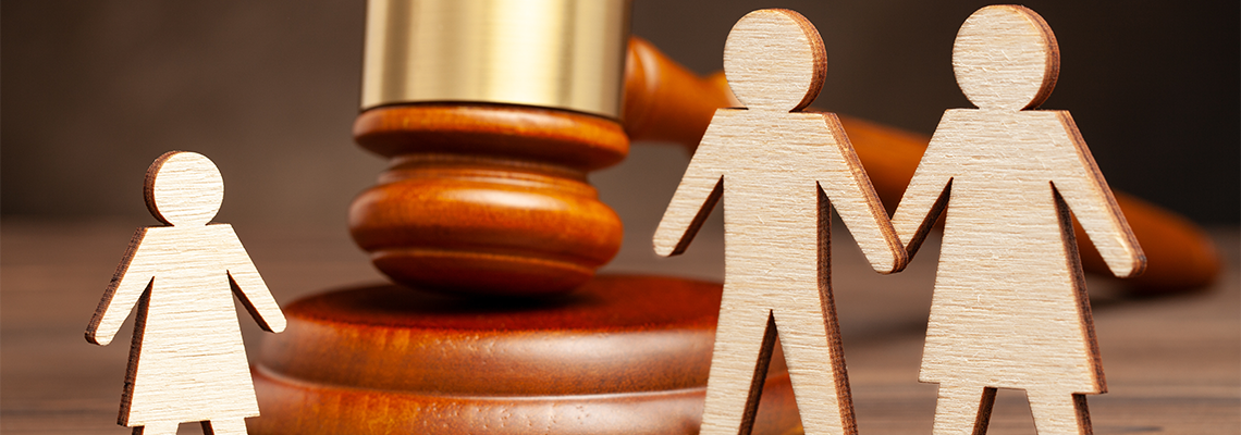 Mother and father apart from the child and judge's hammer