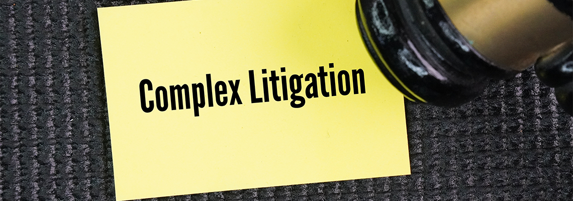 The judge's gavel with the words Complex Litigation