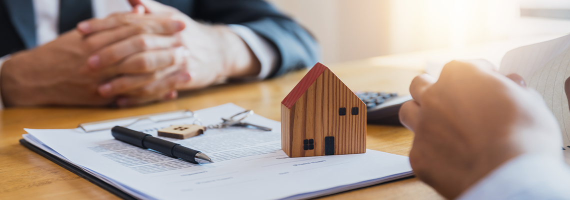 Home buyers meet and negotiate with real estate agents about renting