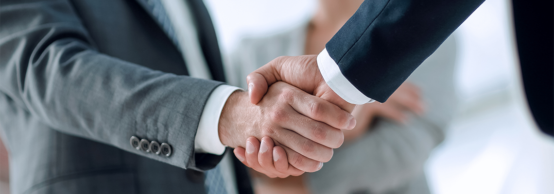 Closeup of handshake after oral agreement