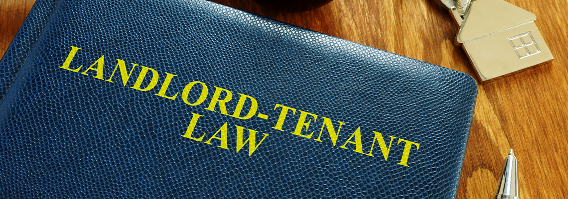 Landlord Tenant Law book and key from home