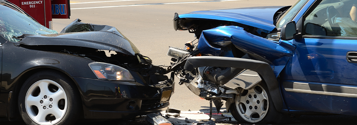 Two cars crash on the street