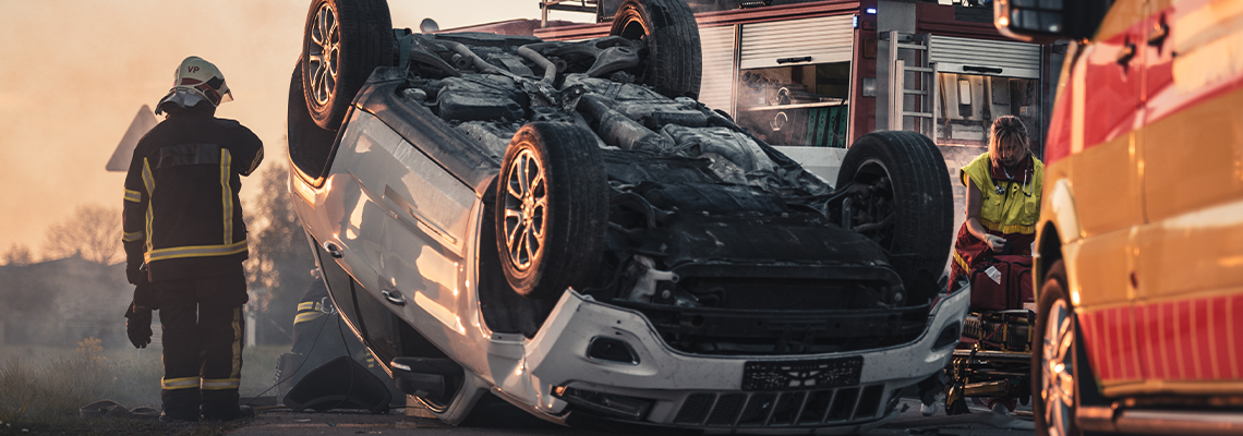 Horrific Traffic Accident Rollover Smoking and Burning Vehicle Lying on its Roof