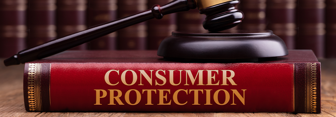 Wooden Gavel And Soundboard On Consumer Protection Law Book