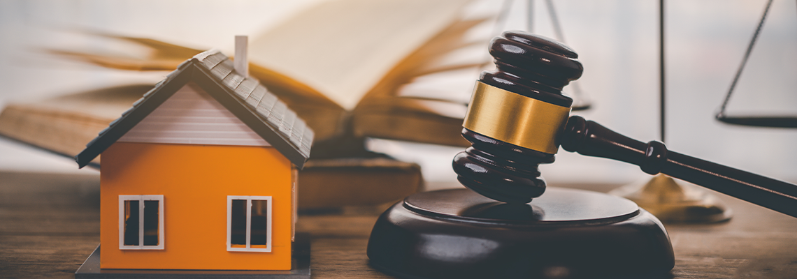 Model of house and gavel on a table