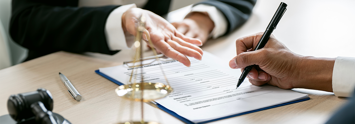 Business people negotiating and signing a contract