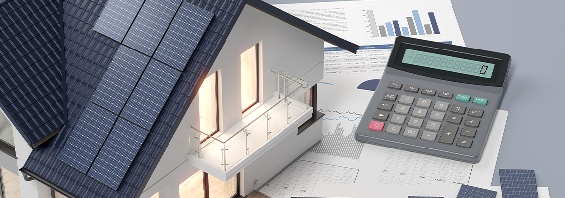 House with photovoltaic solar panel and calculator and documents
