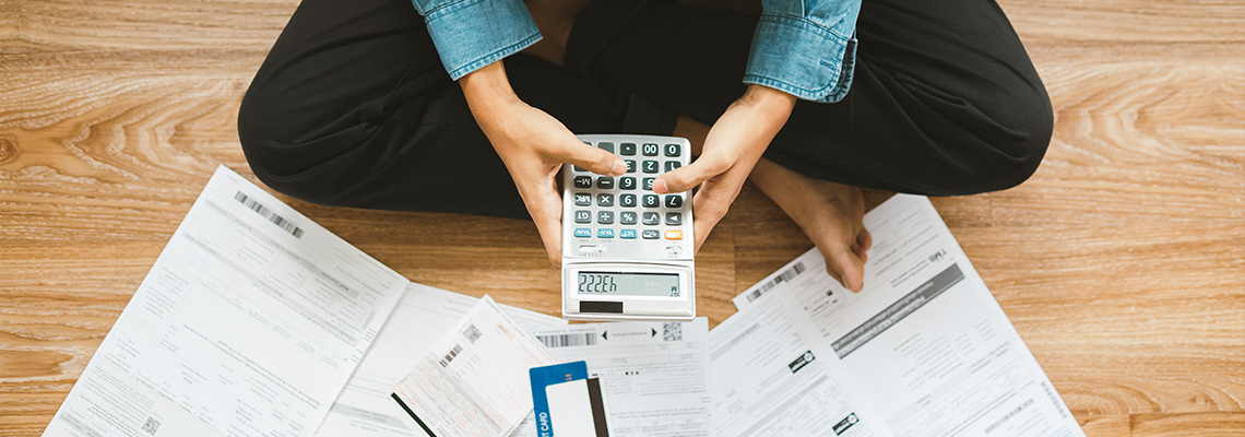 Top view man sitting on the floor stressed and confused by calculate expense