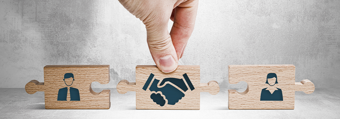 Wooden blocks with an icon of a woman and a man and mediation