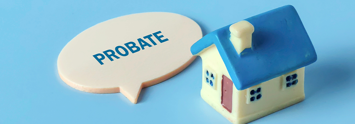 Miniature House Model and Speech Bubble with the Word 'PROBATE'