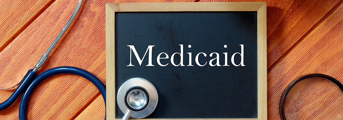 Top view of stethoscope,magnifying glass,plant and blackboard