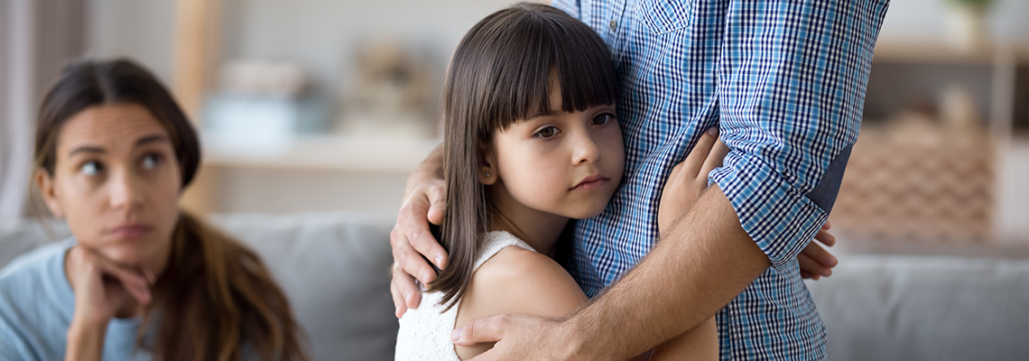 Unhappy little child hug leaving parent say goodbye at home