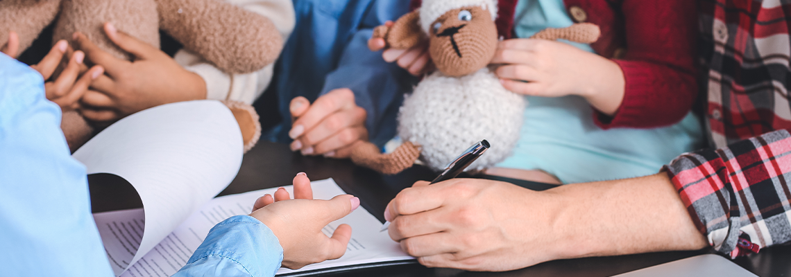 Social worker meeting with couple for signing adoption documents