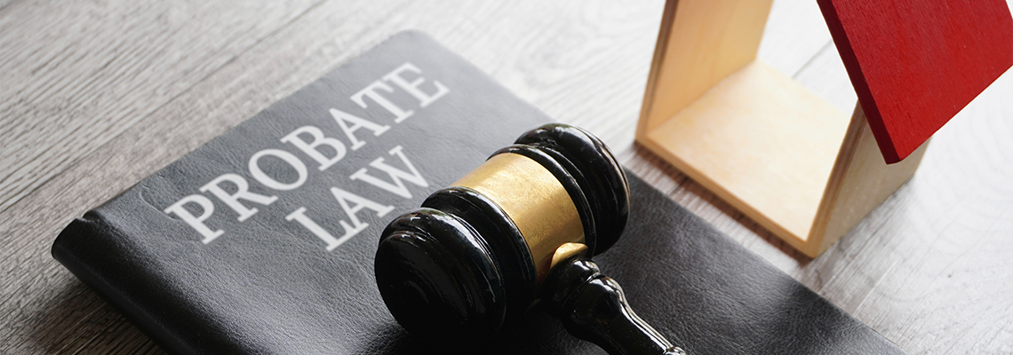 Toy house, gavel and text PROBATE LAW
