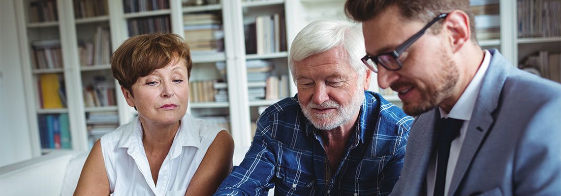 Senior couple preparing estate plan with the help of attorney