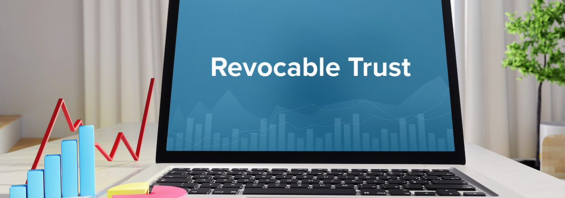 Revocable Trust – Statistics/Business. Laptop in the office with term