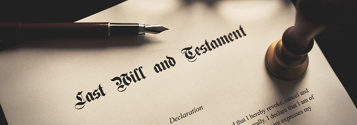 Last Will and Testament Form with Pen on Table