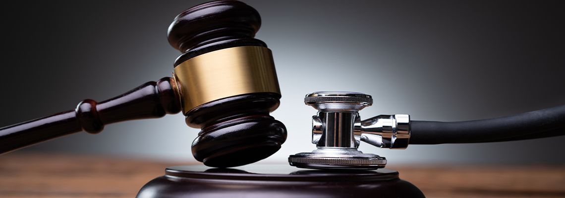 Gavel and Stethoscope in desk