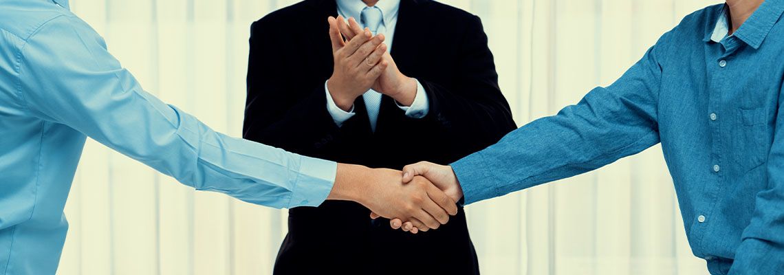 People shaking hands after successful arbitration