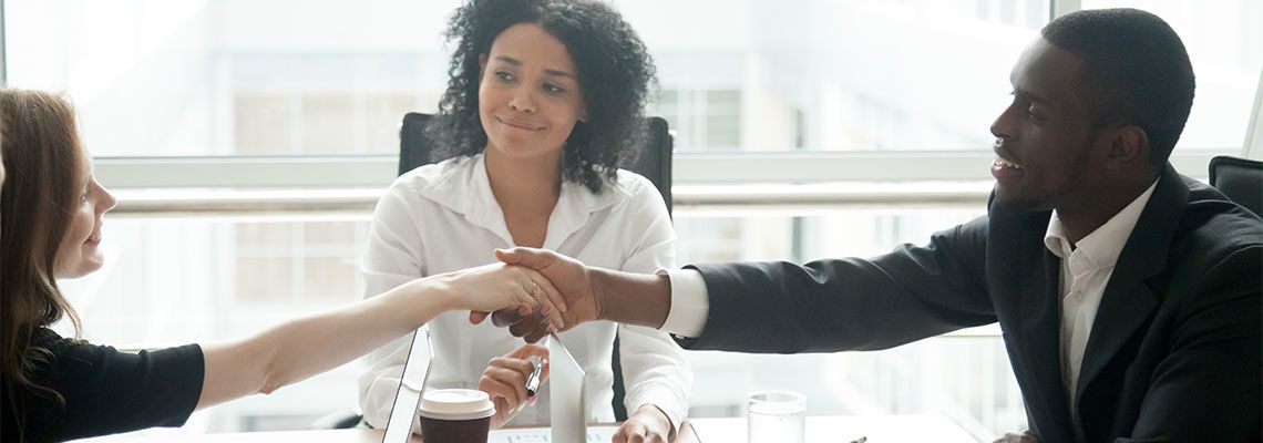 Businesspeople shaking hand after successful arbitration