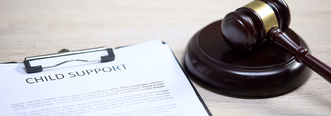 Child support document table, gavel lying on sound block, family law