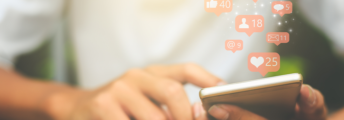 Young man using social media on smart phone