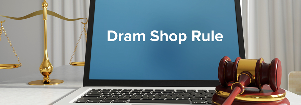 Dram Shop Rule – law, jurisdiction. A lawyer laptop in the office on desk