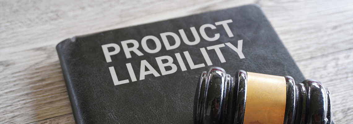 Closeup image of judge gavel and text PRODUCT LIABILITY on table