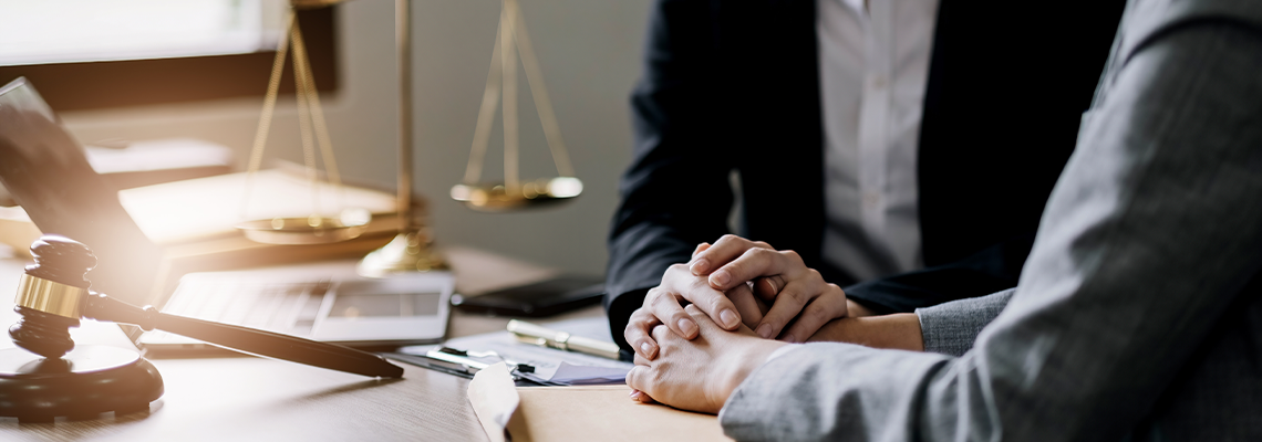 Lawyer meeting and consoling solution to his client provide legal advice