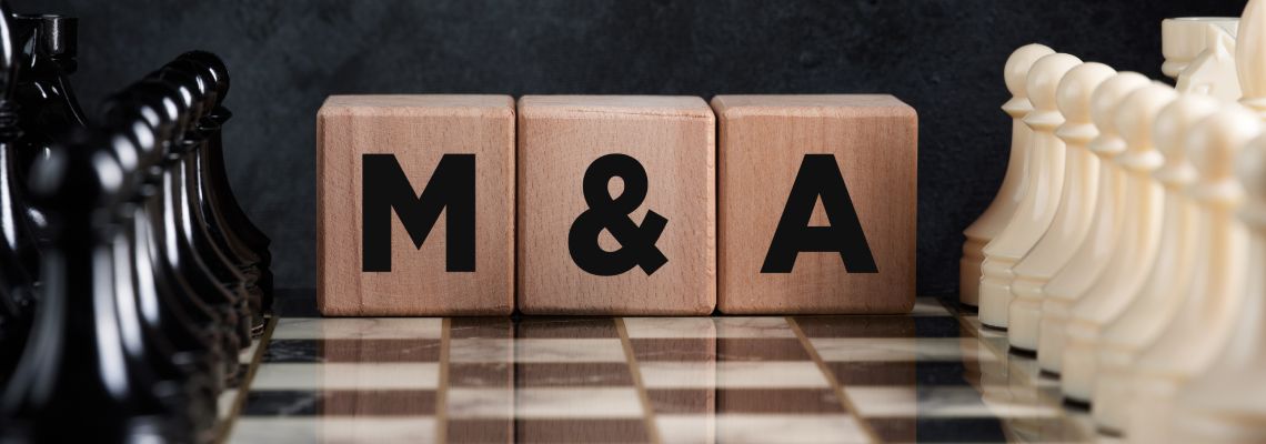 Chessboard with chess pieces and wooden block with words M & A