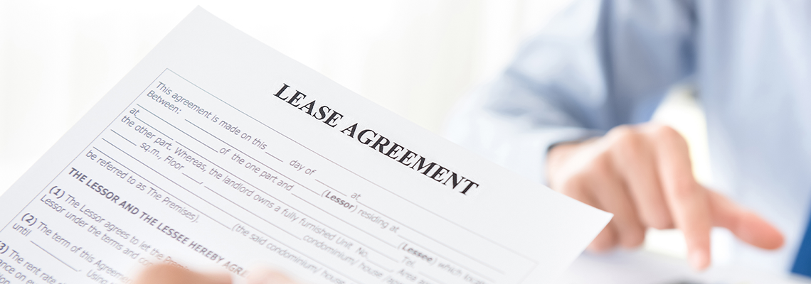 A man reading lease agreement paper