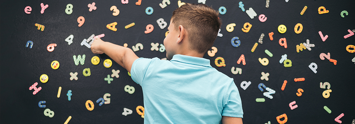 A child works on visual discrimination based on letters and numbers