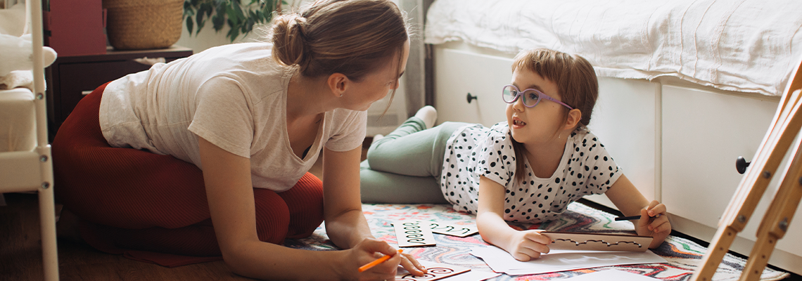Mother and child learning together at home