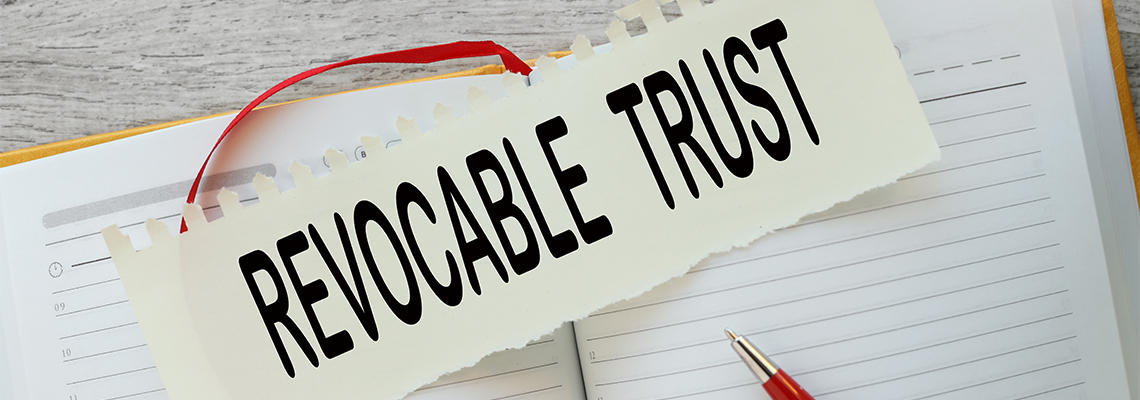 Irrevocable trust text on a torn page on a notepad